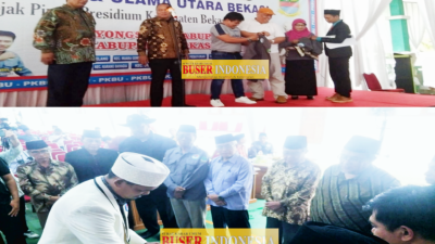 HK Damin Sada Tokoh Nasional tengah menyematkan Baju PKBU Kepada Kepala Desa Di Wilayah Pemekaran Utara Bekasi